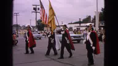 Barrington Illinois USA (1963): Men In Uniforms Carrying Flags Lead Procession Of