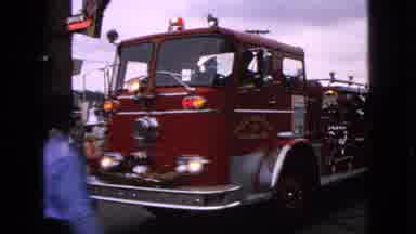 Barrington Illinois USA (1963): An Old Red Fire Engine Is Turning Left In Front Of