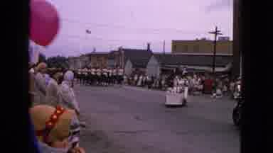 Barrington Illinois USA (1963): People Line The Streets With Balloon To Watch A