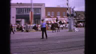 Barrington Illinois USA (1963): Policeman Directing Traffic Near A Train Station