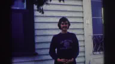 Bowling Green University USA (1963): Person In Sweater Stands Under Tree Smiling