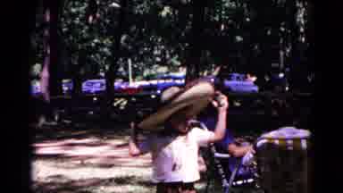 Cold Springs New York USA (1963): A Young Child Wears A Sombrero In A Forest At A