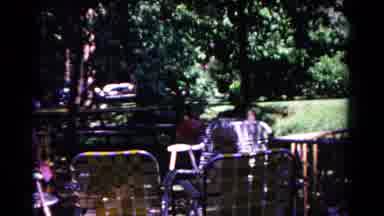 Cold Springs New York USA (1963): Two Young Children Playing In A Yard Full Of