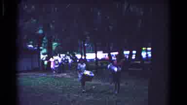 Cold Springs New York USA (1963): People Carrying Heavy Items In A Park