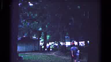 Cold Springs New York USA (1963): Man Wearing Blue Shirt Walks To Green Building