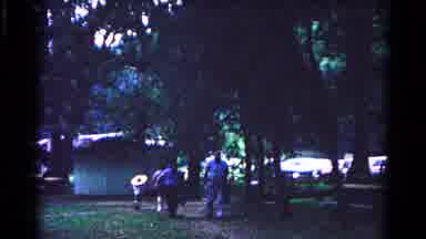 Cold Springs New York USA (1963): Two Men Wearing Blue Shirts Walk Past Trees On