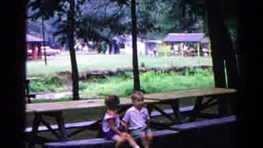 Cold Springs New York USA (1963): Two Small Children Sitting On Picnic Benches At