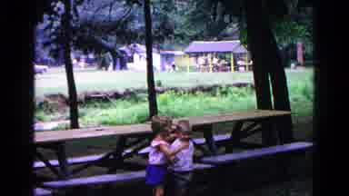 Cold Springs New York USA (1963): Sister Encourage Little Brother Forward At The