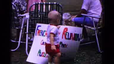 Cold Springs New York USA (1963): Little Boy Grabbing A Large Sign That Says