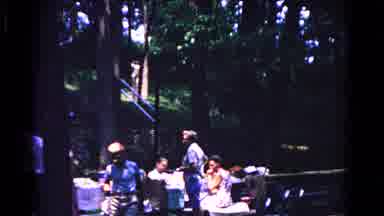 Cold Springs New York USA (1963): A Group Gathering In A Forest With A Man Talking