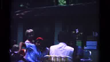 Cold Springs New York USA (1963): People Sitting At Tables In Front Of A Green