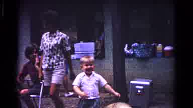 Cold Springs New York USA (1963): Child Playing With Hat With Parental Figure