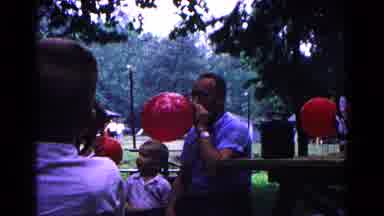 Cold Springs New York USA (1963): Blowing Up Balloons For Child's Birthday Party