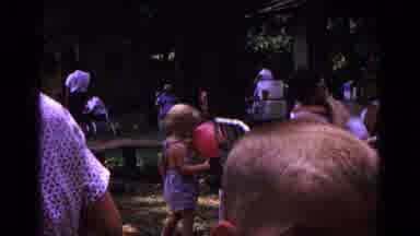 Cold Springs New York USA (1963): Children Playing With Balloons In A Backyard