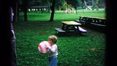 Cold Springs New York USA (1963): Father Showing Young Daughter Grasping Ball To