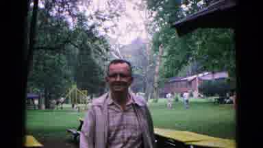 Cold Springs New York USA (1963): A Man In A Park Walks Towards The Camera Past