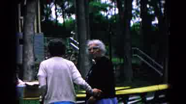 Cold Springs New York USA (1963): Child Hold Balloon Follows Elderly Women