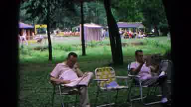 Cold Springs New York USA (1963): Men Sit And Read The Newspaper While Sitting