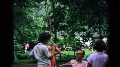 Cold Springs New York USA (1963): People Sitting On The Bench Of A Park Surrounded