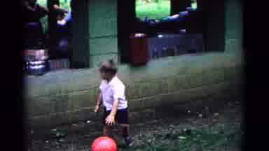 Cold Springs New York USA (1963): Young Boy Playing With A Red Ball