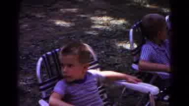 Cold Springs New York USA (1963): Children Sitting In Lawn Chairs In A Row While