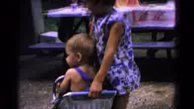 Cold Springs New York USA (1963): Older Child Helps Younger Child With Finger In