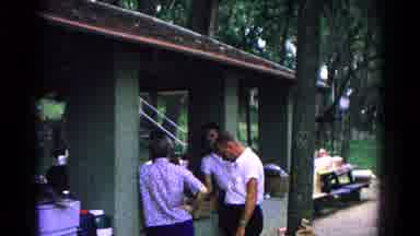 Cold Springs New York USA (1963): A Group Of People Standing Around Talking To