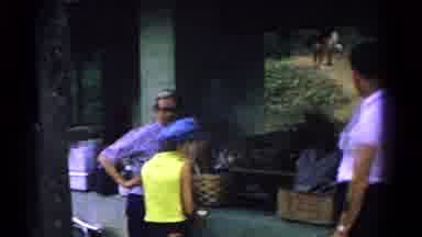 Cold Springs New York USA (1963): Man Playing Horseshoes And A Woman Brushing Off