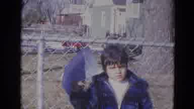 Lincoln Nebraska (1963): Kid Standing In Front Of A Fence
