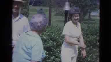 Lincoln Nebraska (1963): People Laugh And Gather In Garden In Front Of House And