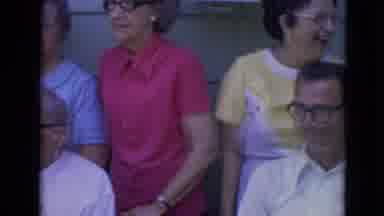 Lincoln Nebraska (1963): People Wearing Glasses Stand Beside Greenhouse For Group