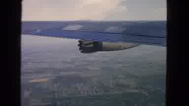 San Francisco California (1963): Jet Engine Plane Flying Over A Town With The Wing