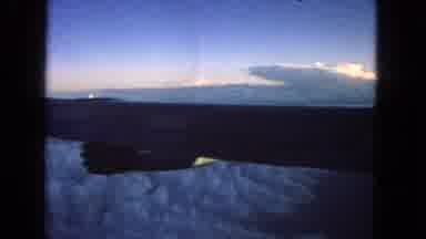 San Francisco California (1963): Airplane Wing Seen Through Window Flies Over Grey
