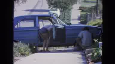 San Francisco California (1963): Woman Looking Inside Car While Gentlemen Changes