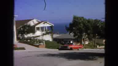 San Francisco California (1963): Man Getting Into His Red Car On The Road To Drive