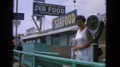 San Francisco California (1963): Smiling Woman Standing On The Dock In Front Of A