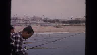 San Francisco California (1963): A Scene At Beach From Pier Of People Fishing With