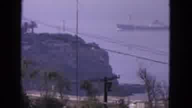 San Francisco California (1963): Boat Approaching Shore While Cars Drive On Road