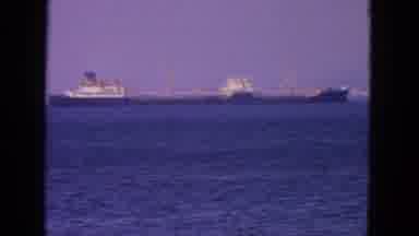 San Francisco California (1963): Ship In The Ocean Floating As Birds Scurry Bu