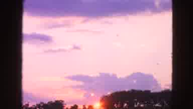 Walworth Wisconsin USA (1963): The Sun Rising Over A Tree Filled Hill On A