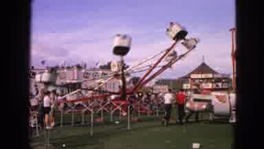 Walworth Wisconsin USA (1963): People Riding Spinning Ride At Fairground