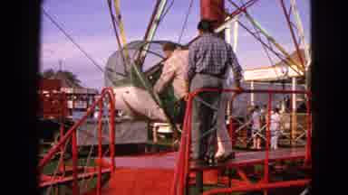 Walworth Wisconsin USA (1963): A Man Climbing Into A Ride At The State Fair