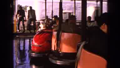 Walworth Wisconsin USA (1963): Several People Sit On A Ride Waiting For It To