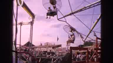 Walworth Wisconsin USA (1963): An Amusement Park Ride Going Around With People