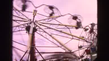 Walworth Wisconsin USA (1963): People Ride On Ferris Wheels Moving At Full Speed