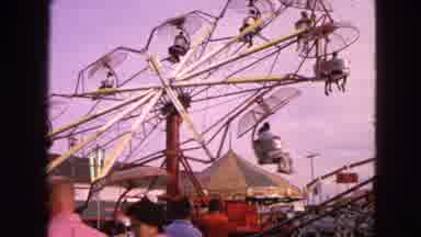 Walworth Wisconsin USA (1963): Humans Participating In Fair Rides On Late Summer