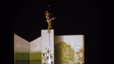 Walworth Wisconsin USA (1963): High Rise Acrobatic Woman Balances On A Narrow Pole