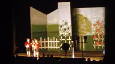 Walworth Wisconsin USA (1963): Three Children Standing On A Stage While Playing