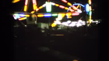Walworth Wisconsin USA (1963): Bright Neon Lights On A Spinning Ride At A Fair Or