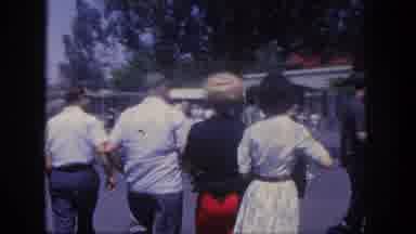 Disneyland California (1962): Men And Women Enter Disneyland Pose For Photo Before